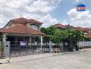 Beautiful single-family home with orange tile roof and landscaped front yard