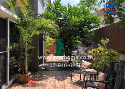 Lush tropical garden with seating area