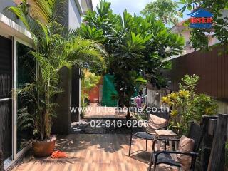 Lush tropical garden with seating area