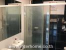 Modern bathroom with glass shower enclosure and sleek design