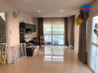 Spacious living room with natural light and sleek design