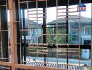 View through window grilles of a residential neighborhood