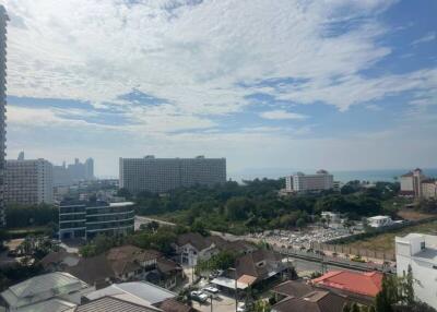 Scenic city and ocean view from high-rise apartment balcony