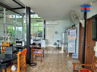 Spacious multi-functional room with kitchen and living area
