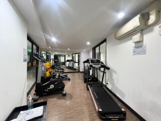 Spacious indoor gym with various exercise equipment