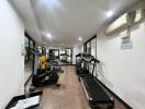 Spacious indoor gym with various exercise equipment