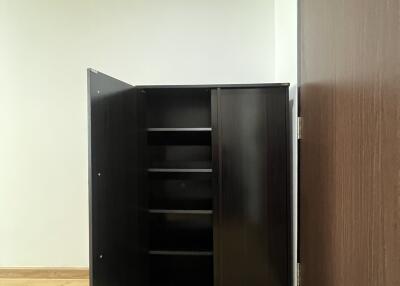 Empty room interior with an open black cabinet