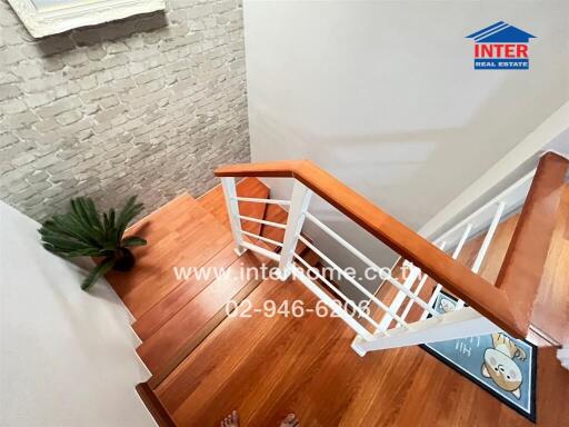 Modern wooden staircase with white accents in a house