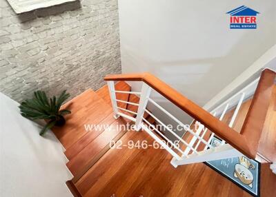 Modern wooden staircase with white accents in a house