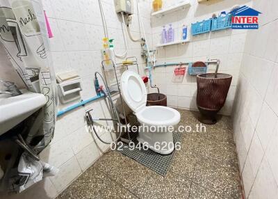 Compact bathroom with toilet and sink