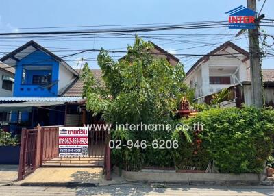 Suburban home front view with lush greenery