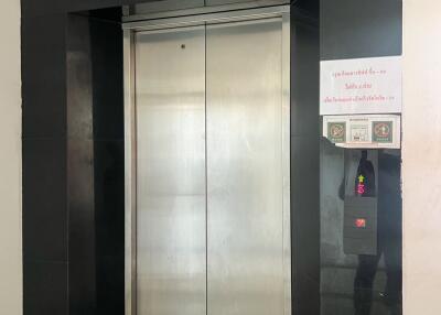 Modern elevator entrance in a building lobby