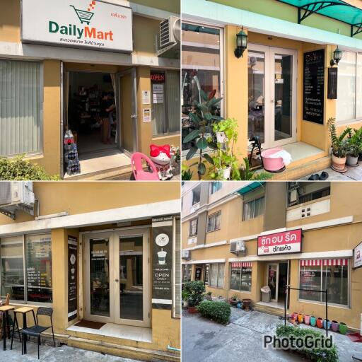 Exterior view of a various small businesses in a commercial building, including a Daily Mart and other shops