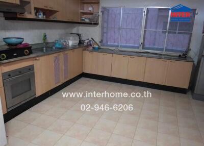 Spacious kitchen with modern appliances and ample counter space