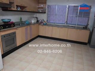 Spacious kitchen with modern appliances and ample counter space