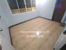 Empty bedroom with wooden flooring