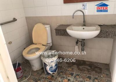 Compact bathroom with toilet and sink