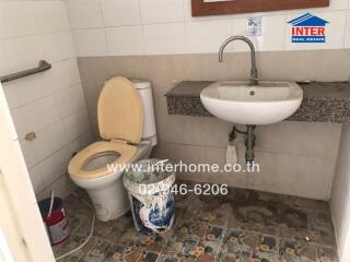 Compact bathroom with toilet and sink