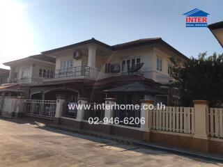 Spacious two-story house with balcony and gated entrance