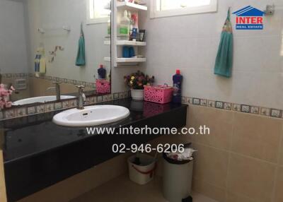 Well-equipped bathroom with modern amenities and storage space