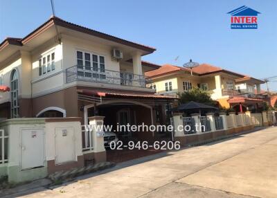 Spacious two-story house with balcony and carport