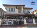 Spacious two-story house with balcony and secure front gate