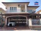 Spacious two-story residential home exterior with covered parking