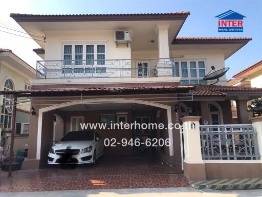 Spacious two-story residential home exterior with covered parking