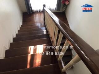 Elegant wooden staircase in a well-lit home