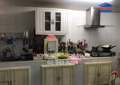 Spacious kitchen with modern appliances and ample cabinet storage