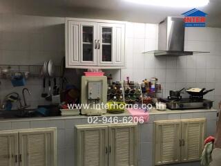 Spacious kitchen with modern appliances and ample cabinet storage