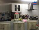 Spacious kitchen with modern appliances and ample cabinet storage