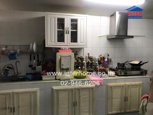 Spacious kitchen with modern appliances and ample cabinet storage