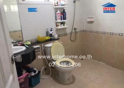 Compact residential bathroom with essential amenities