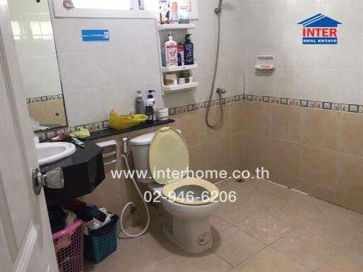 Compact residential bathroom with essential amenities