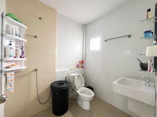 Spacious modern bathroom with essential amenities
