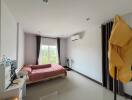 Spacious bedroom with modern amenities and balcony access