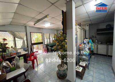 Spacious and well-lit living room connected to kitchen area