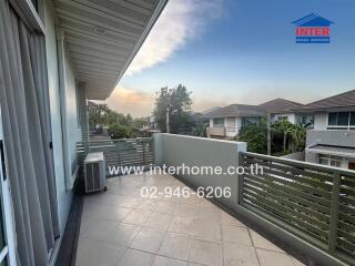 Spacious balcony with scenic sunset view in a residential area