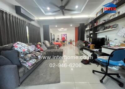 Spacious and modern living room with comfortable furnishings and home entertainment system