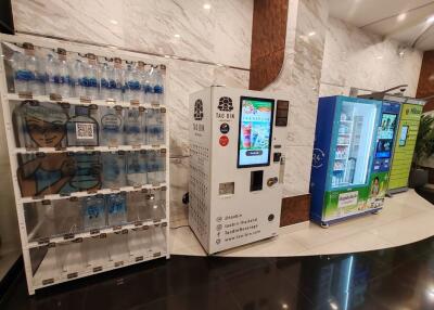 Modern lobby with vending machines and water dispenser