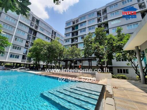 Modern apartment building with outdoor swimming pool and landscaped area