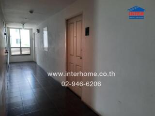 Bright and spacious apartment hallway with natural lighting