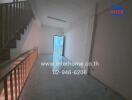 Interior view of a spacious hallway with stair access in a building