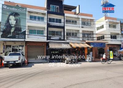 Exterior view of a commercial building with storefronts