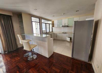 Modern open plan kitchen with breakfast bar and bright natural light