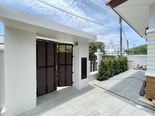 Modern house exterior with spacious driveway and elegant entrance