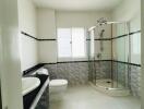 Modern bathroom with shower cubicle and dual sinks