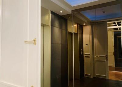 Elegant apartment hallway with modern lighting and detailed door design
