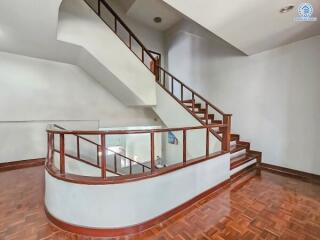 Elegant staircase with wooden banister in a modern home